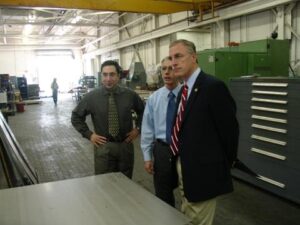 2006: Our team members with Congressman Tim Murphy  (R, District 18) on the floor of QXL Metals in Pittsburgh. 